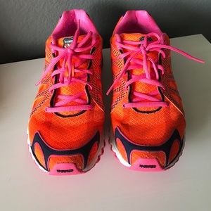 Orange running shoes